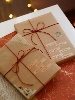 Charming scene of gifts wrapped in brown paper with red strings, perfect for holiday celebrations.