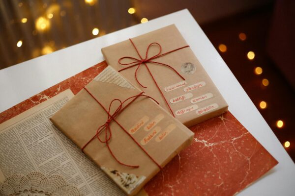 Charming scene of gifts wrapped in brown paper with red strings, perfect for holiday celebrations.